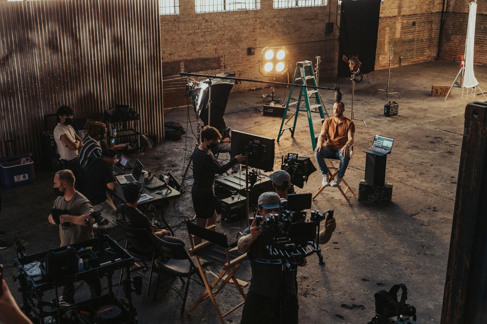A small crew setting up a camera